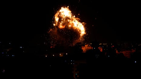Moment rocket hits Hamas-run television building in Gaza strip - video