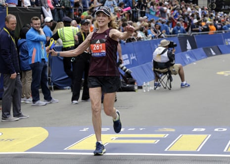 Kathrine Switzer, 70, crosses the finish line in the Boston Marathon.