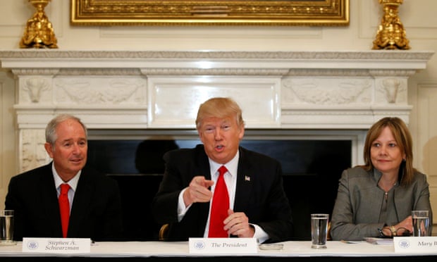 Trump flanked by Blackstone CEO Stephen Schwarzman, a Momentive investor and Trump’s ‘jobs czar’, and General Motors CEO Mary Barra.