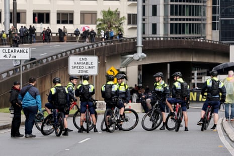 Police wait for demonstrators to cross the Sydney Harbour Bridge