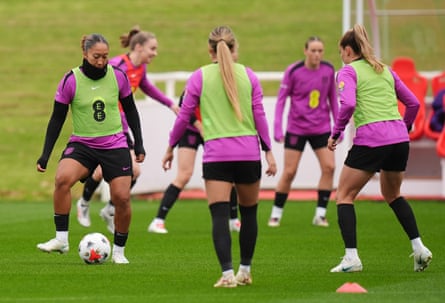 Lauren James passes the ball in training