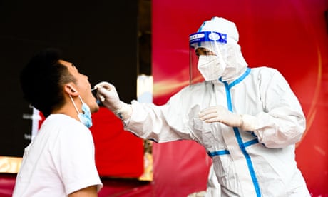 China Yunnan Ruili Covid 19 Test - 05 Jul 2021<br>Mandatory Credit: Photo by Xinhua/REX/Shutterstock (12196225e) A medical worker collects a swab sample for nucleic acid test in Ruili City of southwest China's Yunnan Province, on July 5, 2021. Ruili City on Monday imposed entry and exit restrictions after the emergence of new COVID-19 cases. The city reported three new locally transmitted confirmed COVID-19 cases on Sunday. Authorities have asked people to refrain from entering or leaving the city unless necessary. China Yunnan Ruili Covid 19 Test - 05 Jul 2021
