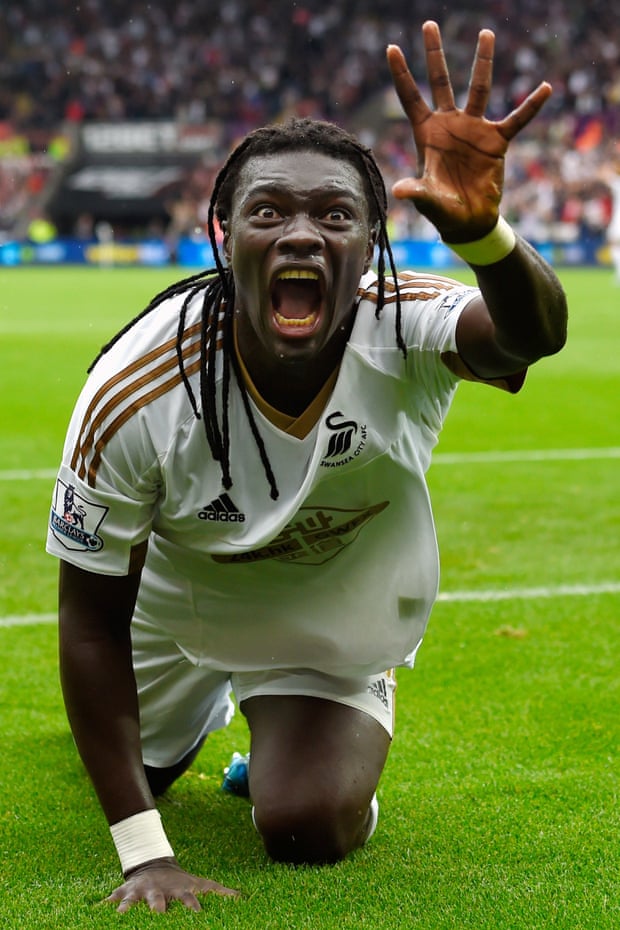 Swansea striker Bafetimbi Gomis shows how he looks after scoring the winning goal against Manchester United.