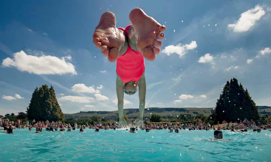 A girl dives into Ilkley’s outdoor pool.