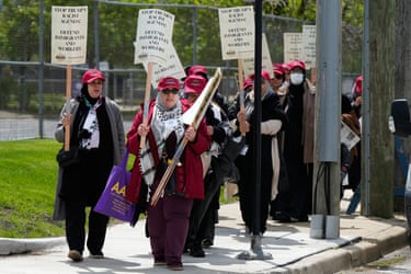 people hold signs