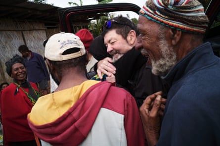 Australian Documentary filmmaker Bob Connolly is greeted by Ganiga people as we approach Kilima coffee plantation
