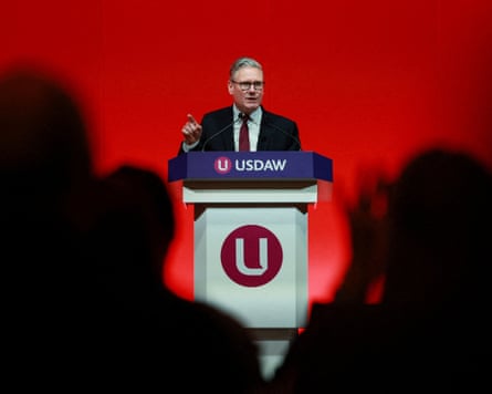 Keir Starmer standing on a stage.