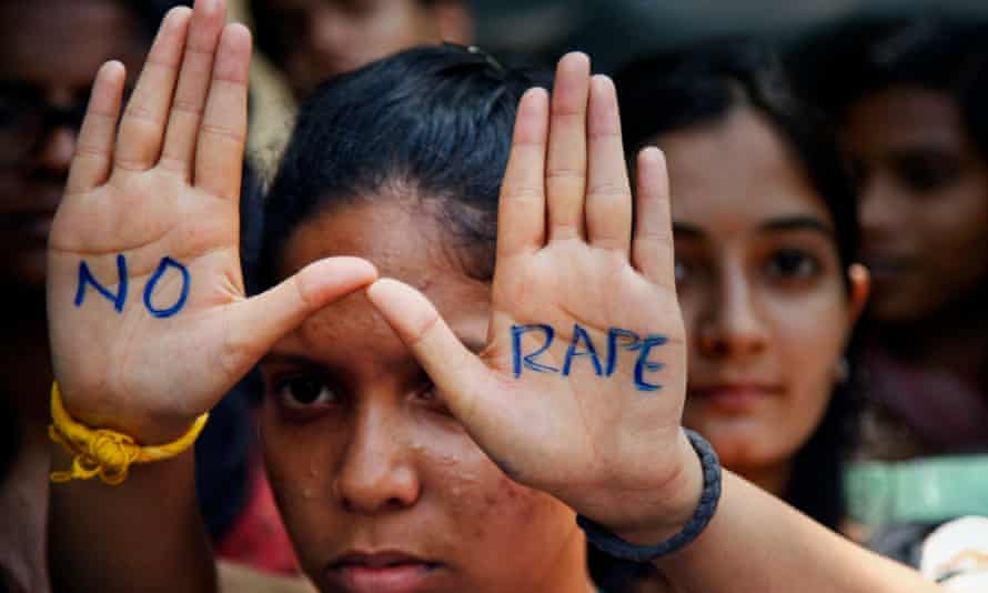 An Indian student displays a ‘No Rape’ message painted on her hands during a demonstration to demand the death sentence for four men convicted in the Delhi rape case.