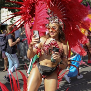 A dancer takes a selfie at the Notting Hill carnival