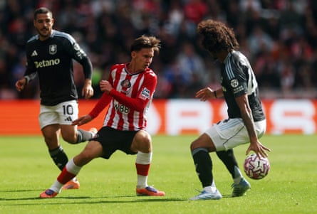Chris Rigg in action with Aston Villa’s Boubacar Kamara