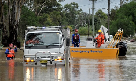 State Emergency Service volunteers rescue animals from flooded farmhouses in western Sydney