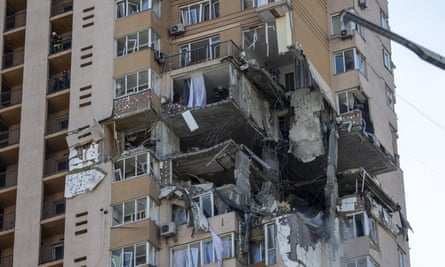 Homes in a Kyiv tower block were torn into by shelling on Friday night as reports came in of fighting in the city’s streets.