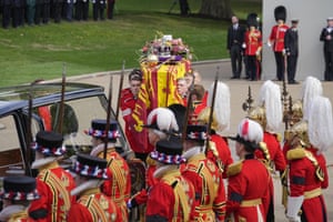 The coffin of Queen Elizabeth II is placed into a hearse at Buckingham Palace