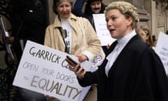 A protest outside the Garrick club featuring a placard that reads 'Garrick Club, open your doors to equality'