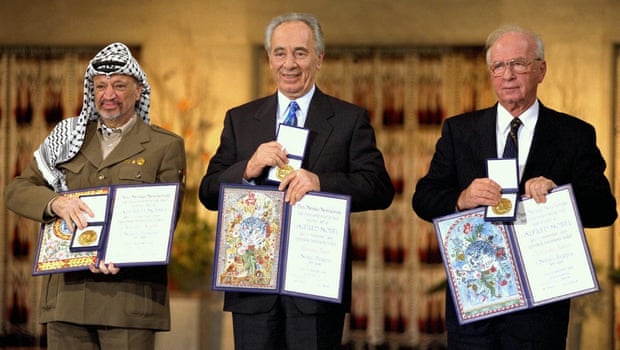 Arafat, Peres and Rabin with their Nobel awards in Oslo, Norway, in 1994.