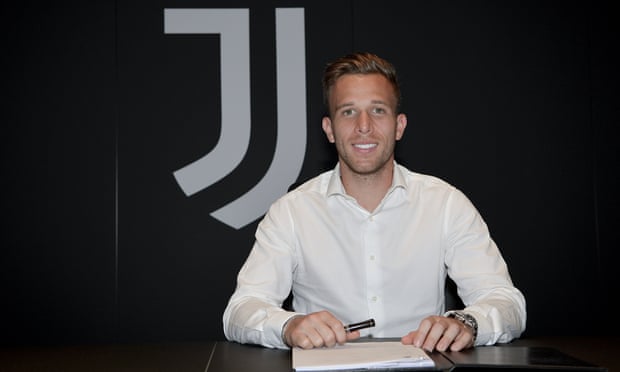 Arthur signs his Juventus contract in Turin.