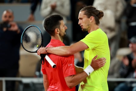 Alexander Zverev embraces Novak Djokovic