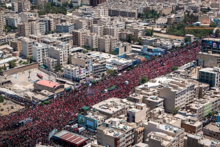 Huge crowd gathered for the late supreme leader's funeral procession.