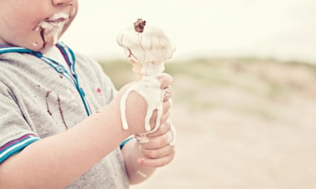 Child eating melted ice-cream