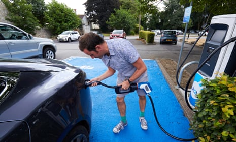 Guardian journalist Adam Vaughan charging a Tesla car at a Polar electric vehicle station at the Holiday Inn hotel off the A1 in Doncaster.
