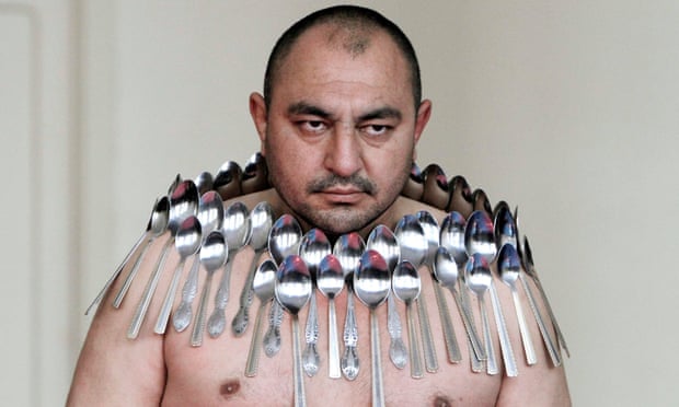 Etibar Elchiyev attempts to break the Guinness World Record for 'most spoons on a human body.