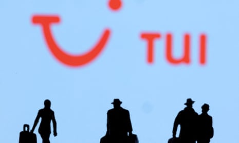 Silhouetted people with suitcases walk in front of a Tui logo