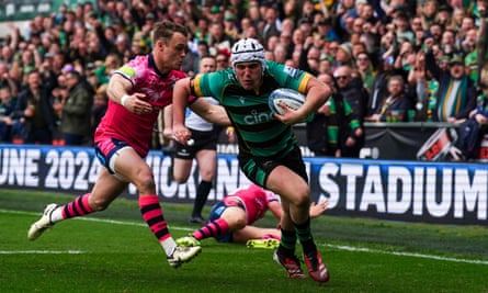 Curtis Langdon runs in a try for Northampton.