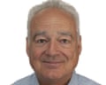 A man with grey hair facing the camera