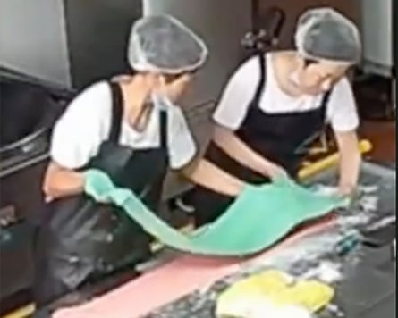 CCTV of kitchen staff adding colourant into flour