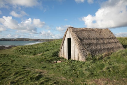 The last remaining thatched hut from the once booming cottage industry stands alone on the Pembrokeshire coastal path overlooking the beach of Freshwater West.