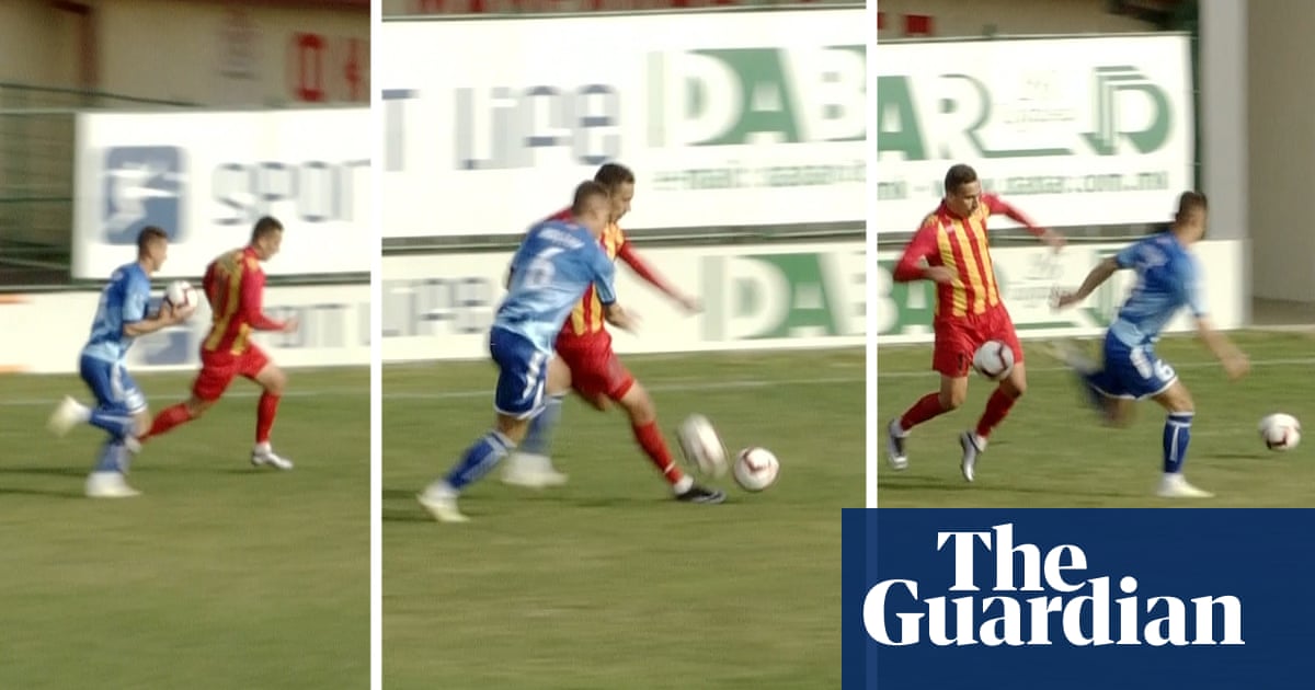 Player throws spare ball to tackle opponent in North Macedonia – video