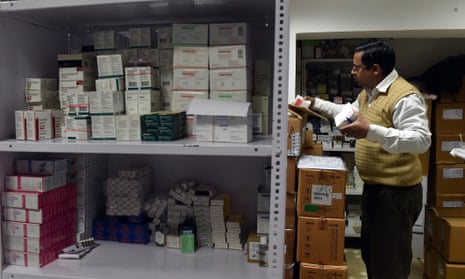 A New Delhi pharmacist sorts medicines in a storeroom