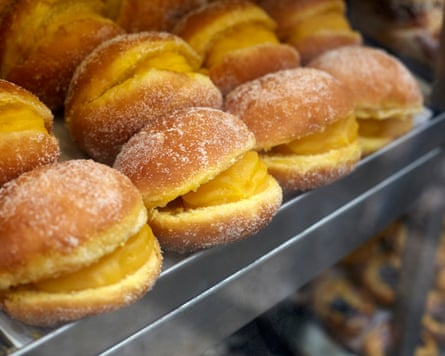 Rows of Bola de Berlim (Portuguese doughnut) on tray