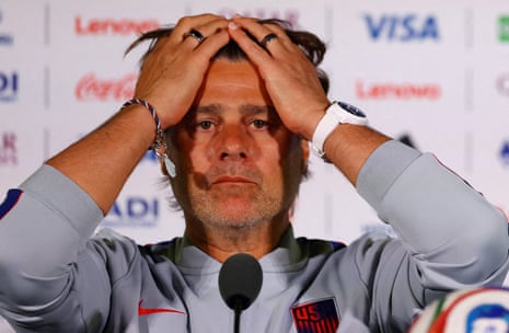 Mauricio Pochettino at a press conference pushing back his air with both hands
