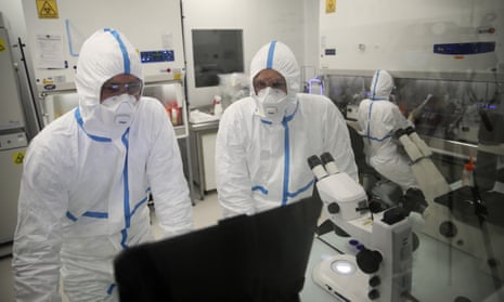 Laboratory technicians work at the Valneva headquarters in Saint-Herblain, western France.