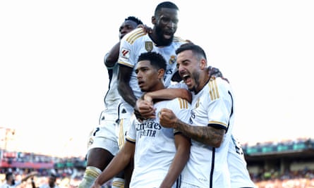 Joselu (right) celebrates Jude Bellingham’s goal alongside Antonio Rüdiger and Vinícíus Junior during the La Liga match between Barcelona and Real Madrid at Estadi Olímpic Lluís Companys on 28 October 2023