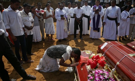 A mass burial of victims at a cemetery near St Sebastian church in Negombo, Sri Lanka
