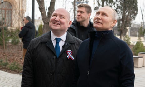 Russian president Vladimir Putin in Sevastopol, accompanied by Governor of Sevastopol Mikhail Razvozhayev.