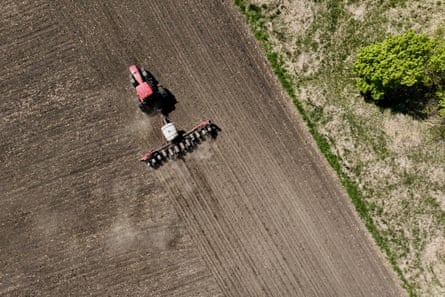 a tractor planting soybeans
