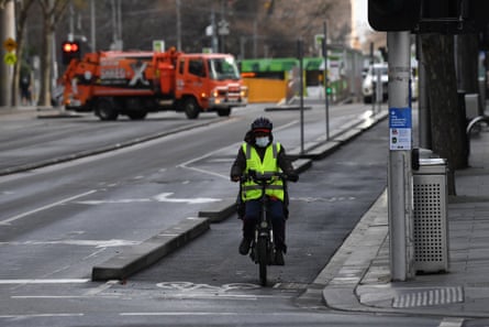 A cyclist wearing a face mask is seen in Melbourne