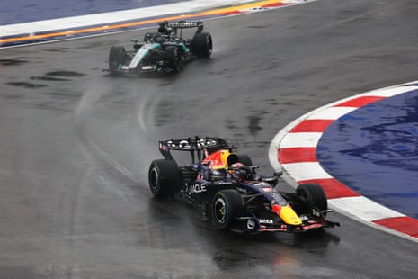 Max Verstappen in his Red Bull RB22 and George Russell in his Mercedes W17 on the formation lap.