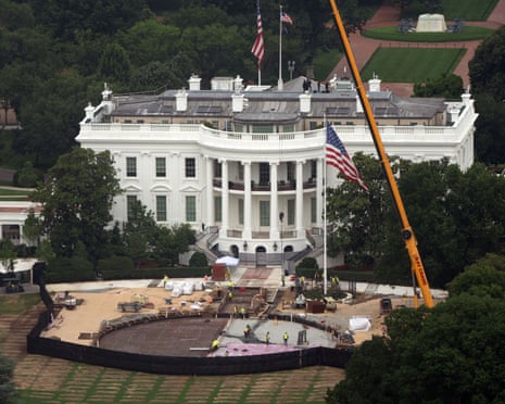 Workers building the helipad on the South Lawn of the White House on Friday.