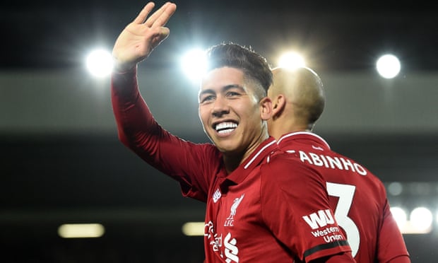 Roberto Firmino celebrates the penalty that put Liverpool into a 5-1 lead at Anfield.