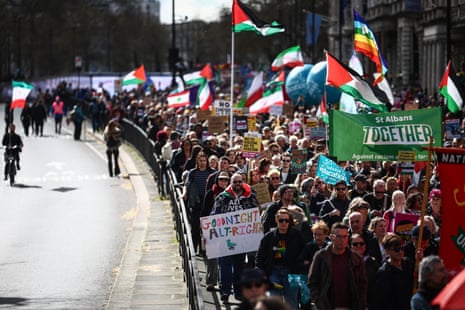 People take part in a Together Alliance march