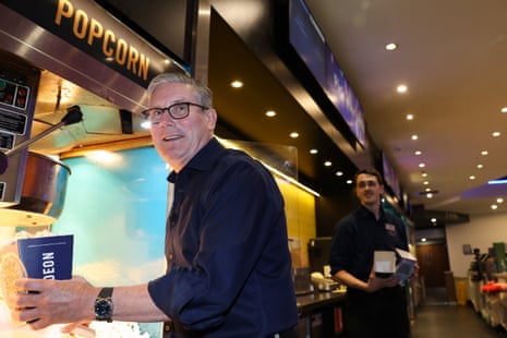 Starmer serving popcorn.