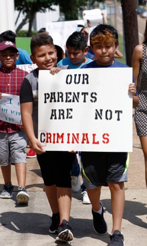Children of mainly Latino immigrant parents hold signs in support of them and those individuals picked up during an immigration raid at a food-processing plant, during a protest march to the Madison county courthouse in Canton, Mississippi on 11 August 2019.