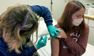 Clinical research coordinator Tammy Lewis-McCauley administers an injection to Katelyn Evans, a trial participant, as part of the hospital’s clinical trial of Pfizer’s COVID-19 vaccine at Cincinnati Children’s Hospital Medical Center in October 2020.