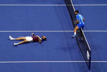 Ageless Djokovic dismantles Medvedev in US Open final to win 24th grand slam title | US Open Tennis 2023 6 Novak Djokovic climbs over the net to check on Daniil Medvedev after he fell