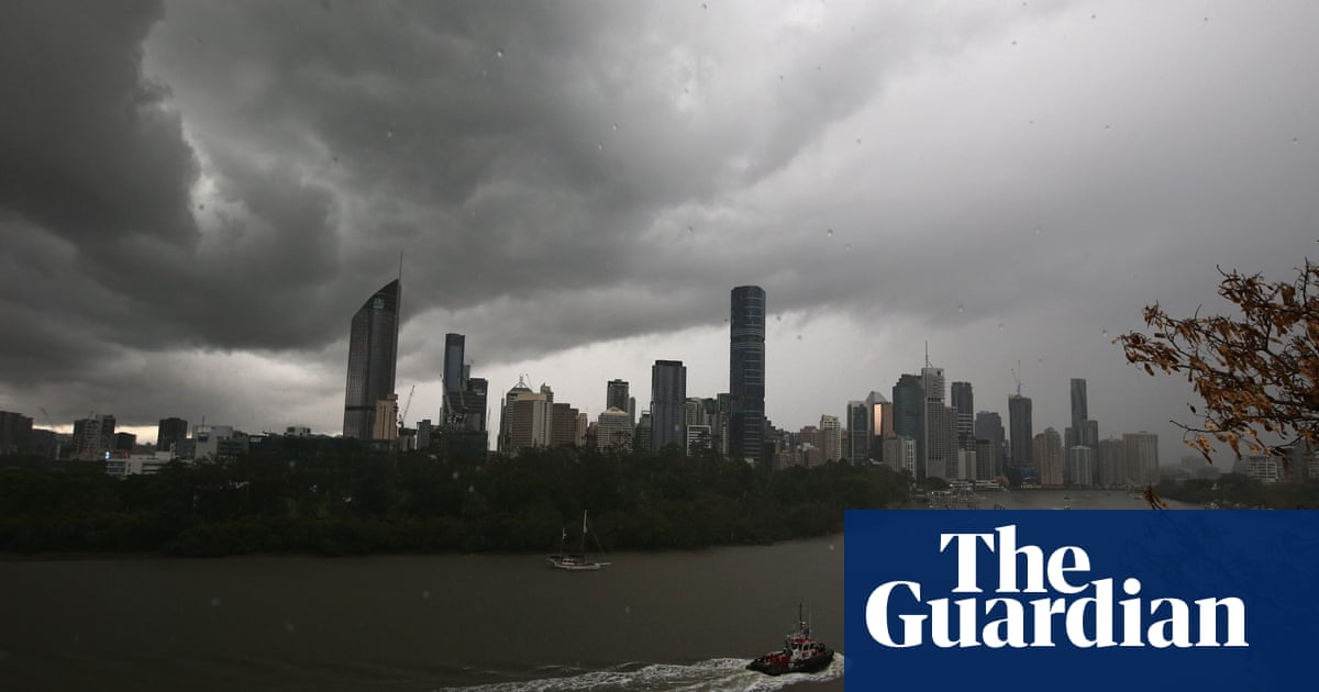 Dams discharged and flood warnings issued as rain buckets south-east Queensland