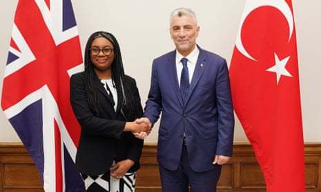 Britain’s business secretary, Kemi Badenoch, greets Turkey’s trade minister, Ömer Bolat, at the start of talks in London on an upgraded free trade agreement.